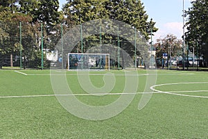 Yaslo, Poland - july 2 2018: Marking a green artificial football field with a grass cover in the city stadium. The place for