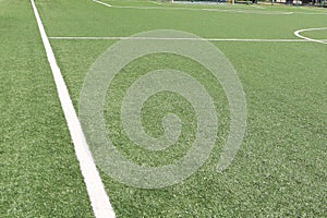 Yaslo, Poland - july 2 2018: Marking a green artificial football field with a grass cover in the city stadium. The place for