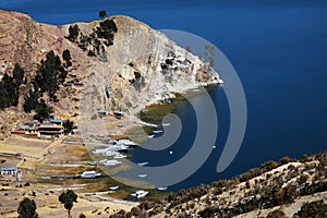 Yatch and boats on Titicaca lake photo