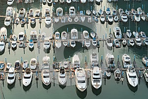 Yatch harbor marina pier and boat dock yatchs and vessels awaiting the open sea. Aerial drone view looking straight down above