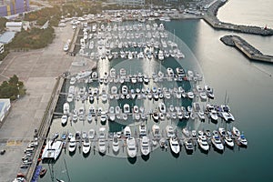 Yatch harbor marina pier and boat dock yatchs and vessels awaiting the open sea. Aerial drone view looking straight down above T- photo