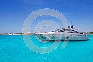 Yatch in turquoise beach of Formentera photo