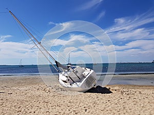 Yatch Yacht shipwrecked in the water on Rockingham Beach Western Australia