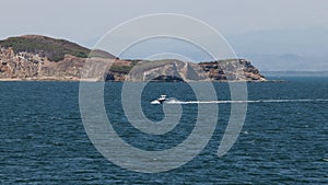 Yate in front of an island photo