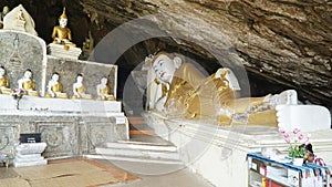 Yathaypyan Cave with golden Buddha statues near Hpa-An, Myanmar / Burma.