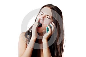Yawing woman answering photo