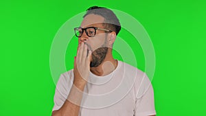 Yawning Man on Green Background