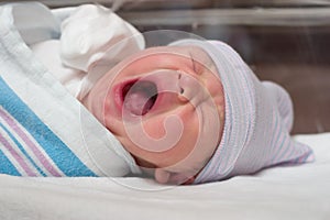 Yawning newborn