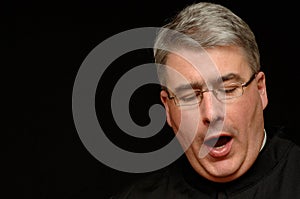 Yawning priest