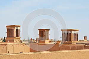 Yazd traditional wind towers on the roofs of old houses, unique Iranian architecture, Yazd, Iran