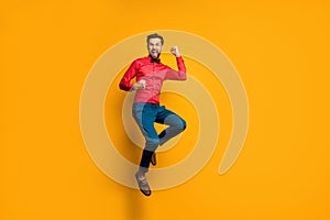 Yeah. Full body photo of funny crazy guy jump high up celebrating lottery money winning wear trendy red shirt bow tie