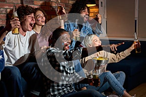 Yeah. Group of friends watching sport competition on TV together