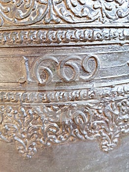 The year 1669 inscribed on a church bell