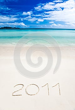 Year 2011 writenn in the sand