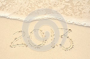 The Year 2013 Written in Sand on Beach