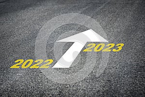 Year 2022 to 2023 and white arrow marking on road surface