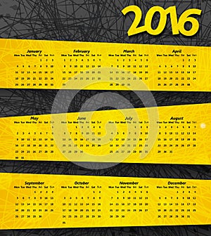2016 year calendar on the abstract dark background with yellow