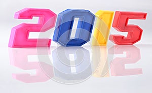 2015 year colorful figures with reflection on white