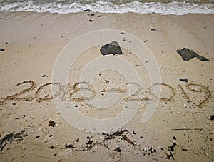 Year concept on the sand