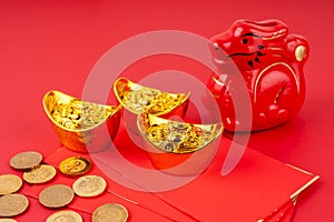 Year of the Dragon with red envelope and gold ingot and coins