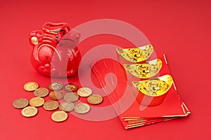 Year of the Dragon with red envelope and gold ingot and coins