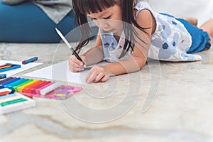 A 3 year old Asian baby girl Lying on the floor