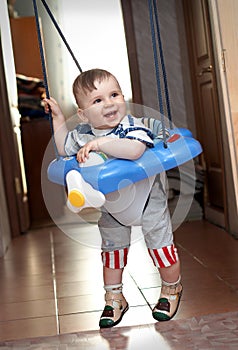 Year-old boy learning to walk