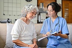 A 60-year-old elderly retire woman and her doctor having a serious talk