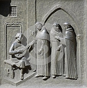 The 14-year-old Huldrych Zwingli making music in the Dominican Monastery in Bern, door of the Grossmunster church in Zurich photo