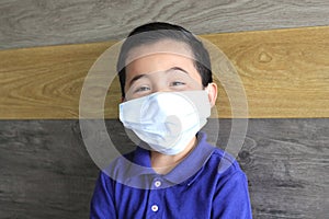 6-year-old Latino boy with covid-19 prevention mask photo