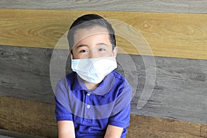 6-year-old Latino boy with covid-19 prevention mask photo