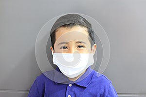 6-year-old Latino boy with covid-19 prevention mask photo