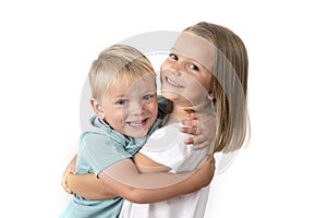 7 years old adorable blond happy girl posing with her little 3 years old brother smiling cheerful isolated on white background