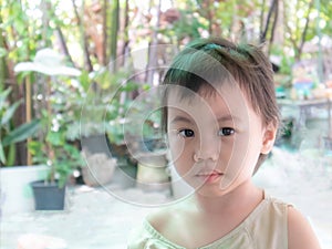 3 years old cute baby Asian girl, little toddler child with adorable short hair looking at camera
