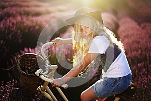 Girl on bicicle lavender photo