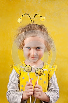 Girl with bee cake pops