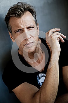 Confident good looking man shooted in studio photo