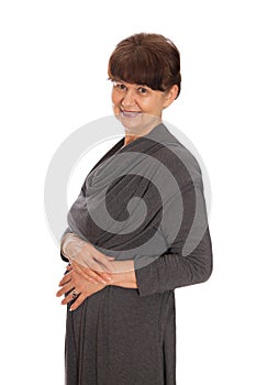 65 years old woman portrait against of white background. Pension age good looking woman smiling, London