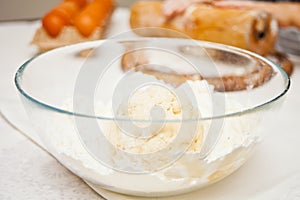Yeast fresh raw dough in a transparent bowl