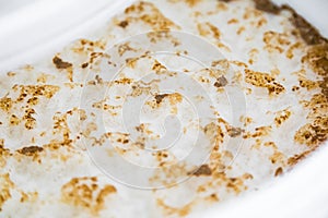 Yeast Krausen in a Bucket of a Homebrewer's Beer Fermenting