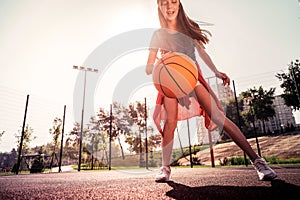 Yelling skinny little girl being experienced in basketball game