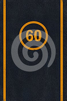 Yellow 60 limit speed caution marking on asphalt