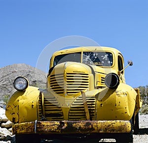 An yellow abandoned Bonnie and Clyde vehicle