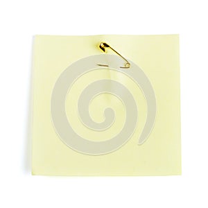 Yellow adhesive note attached safety pin