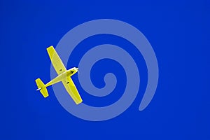 Yellow airplane and blue sky