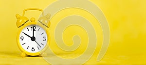 Yellow alarm clock, save or manage time concept, web banner