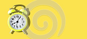 Yellow Alarm Clock on Yellow Background in Banner size