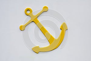 Yellow Anchor on white wall