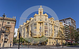 Yellow apartment building at the Tetuan square in Valencia