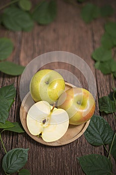 Yellow apple fruit on wooden Background, Toki apples on the old wooden table.